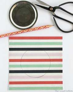 Scrapbook paper mason jar lid cover by www.thecasualcraftlete.com